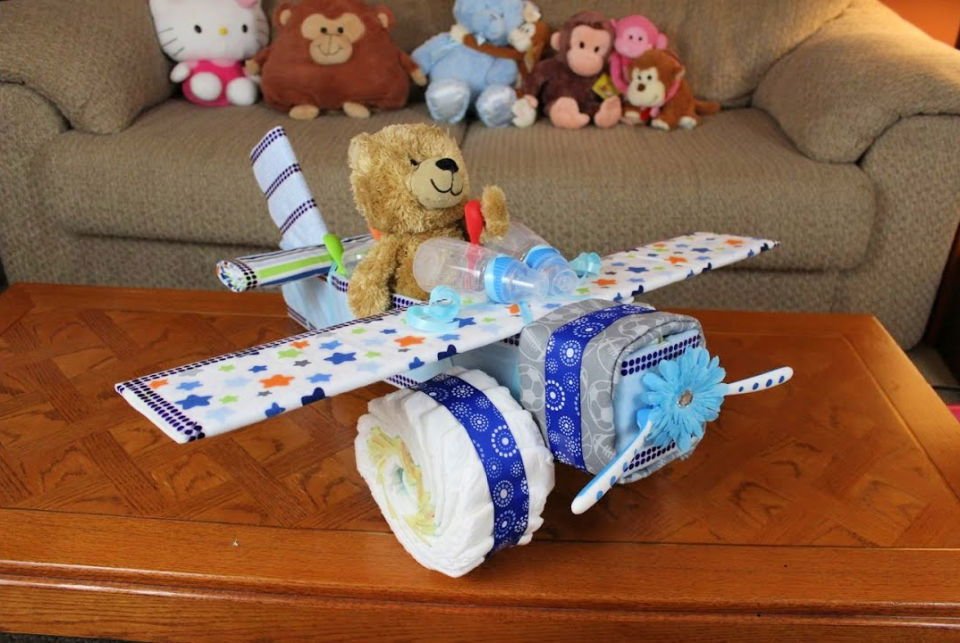 DIY Diaper Cake Ideas: 30 Easy Baby Shower Gift Guide 31 DIY Airplane Diaper Cake for Boys