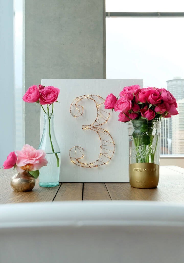 25 DIY Wedding Table Numbers (How to Make Table Numbers) 18 DIY Starry Light Wedding Table Number