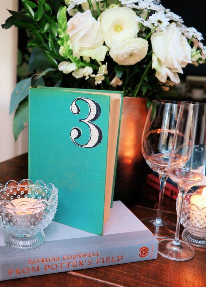 25 DIY Wedding Table Numbers (How to Make Table Numbers) 14 Vintage Book Table Numbers